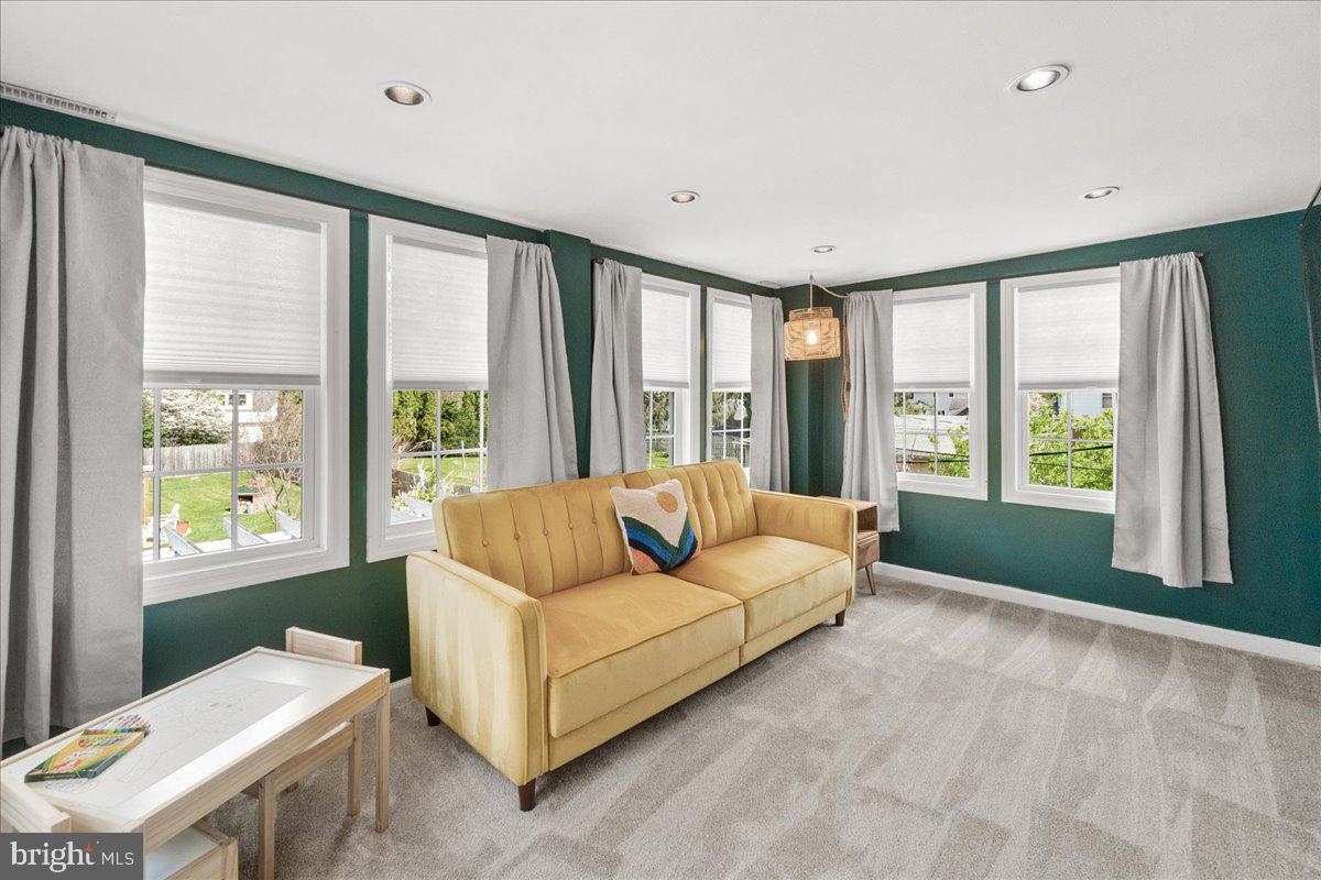 403 Wilson Place Frederick, MD 21702 - Photo 26 of 63 a living room with furniture and a large window