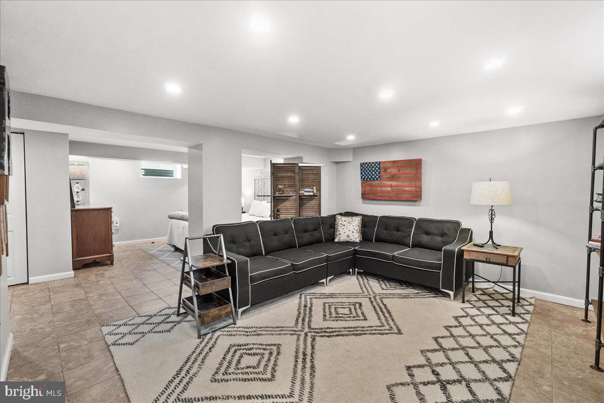 403 Wilson Place Frederick, MD 21702 - Photo 28 of 63 a living room with furniture and a table
