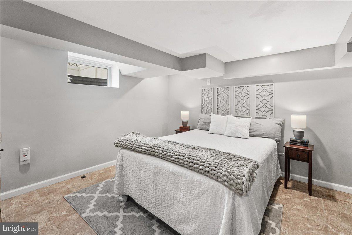 403 Wilson Place Frederick, MD 21702 - Photo 31 of 63 a bedroom with a bed and a night stand