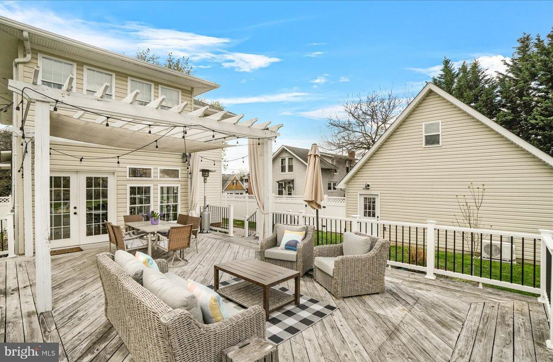 403 Wilson Place Frederick, MD 21702 - Photo 36 of 63 a view of a patio with couches chairs and wooden floor