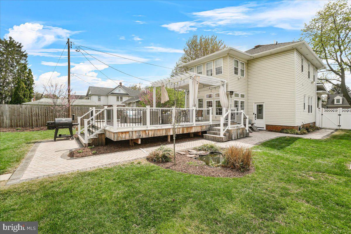 403 Wilson Place Frederick, MD 21702 - Photo 37 of 63 a view of a house with backyard sitting area and garden
