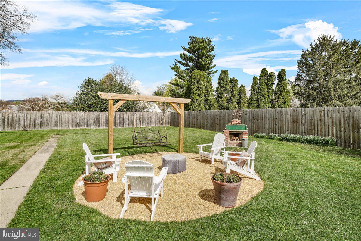 403 Wilson Place Frederick, MD 21702 - Photo 46 of 63 a view of a chair and table in the garden