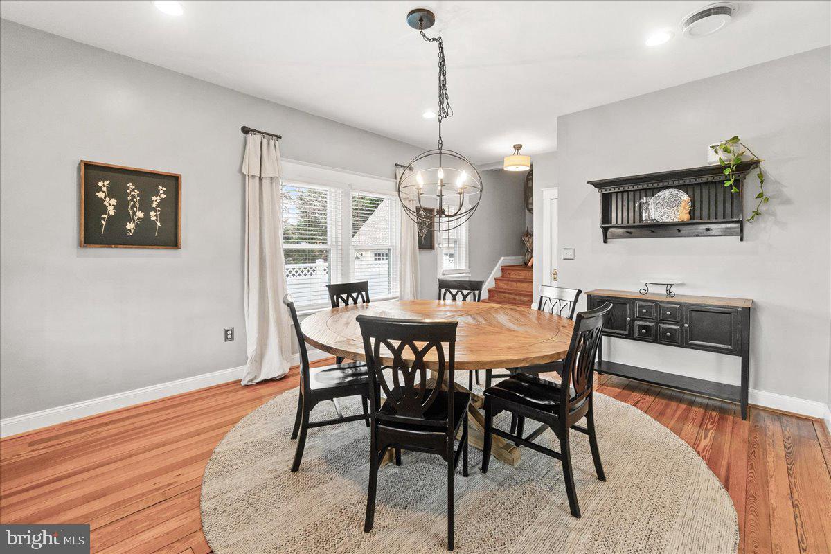 403 Wilson Place Frederick, MD 21702 - Photo 8 of 63 a view of a dining room with furniture and wooden floor