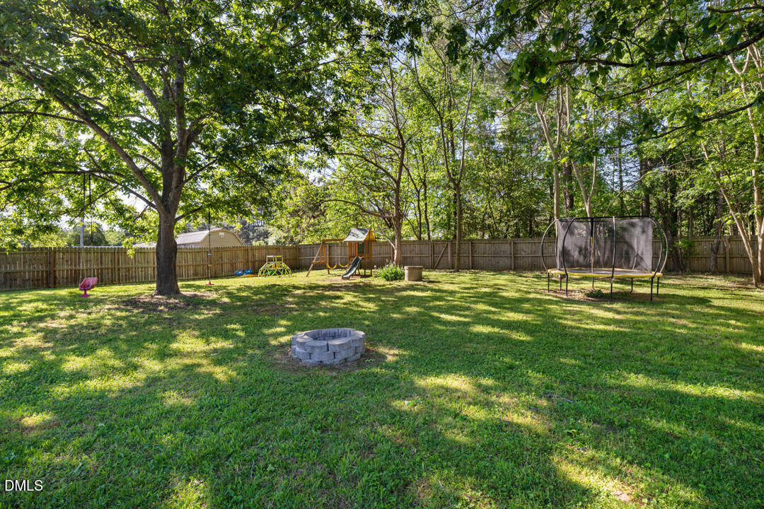 454 Cedar Creek Road Timberlake, NC 27583 - Photo 27 of 39 a swimming pool with outdoor seating and yard