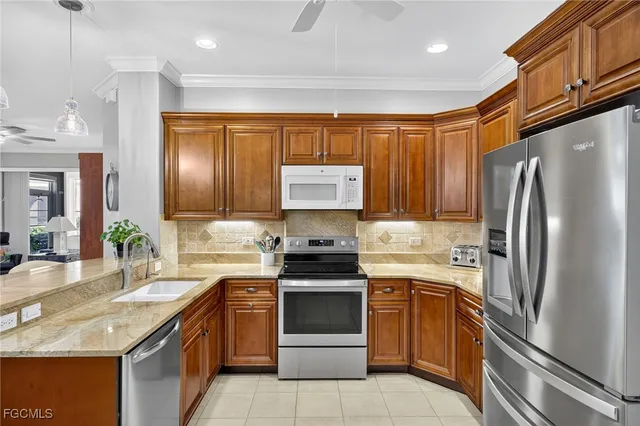 a kitchen with a stove sink and refrigerator