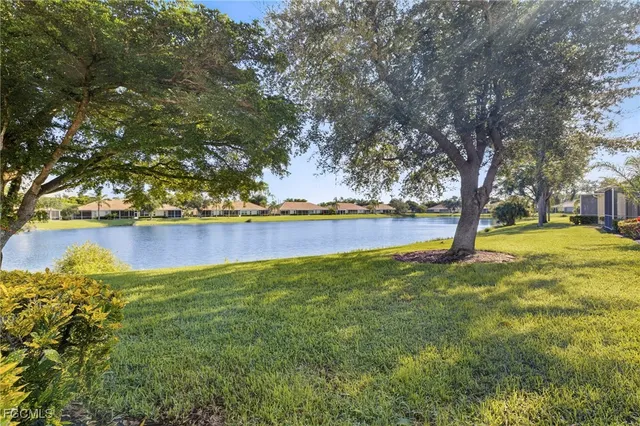 a view of yard with swimming pool and seating space