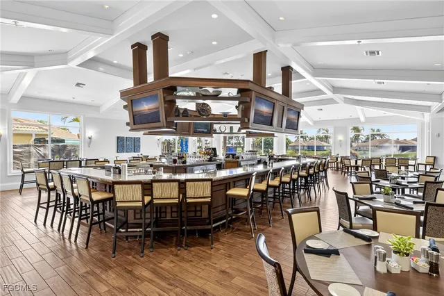a large kitchen with a table and chairs