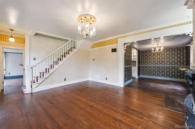 a view of an entryway with wooden floor
