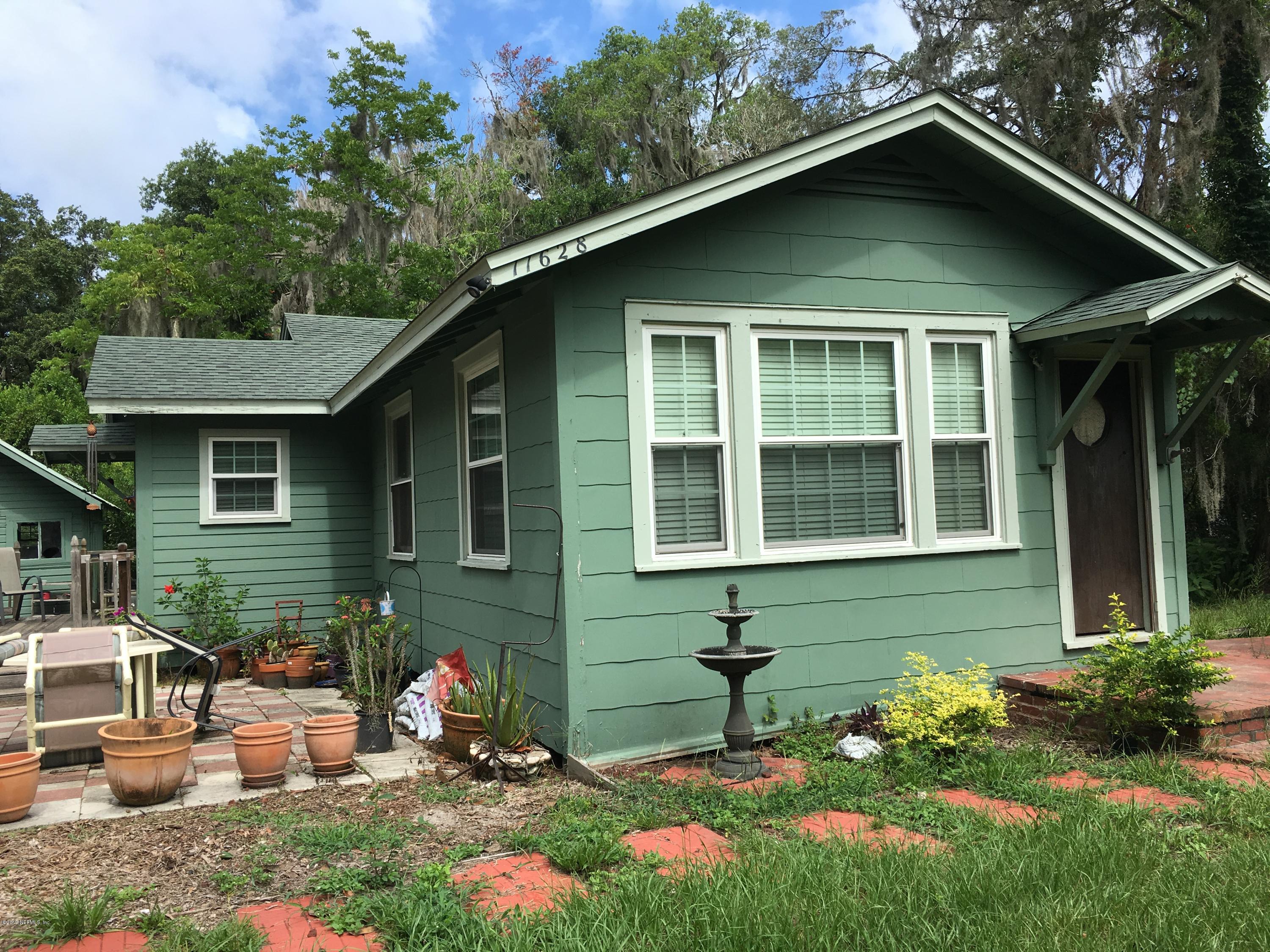 11628 Flynn Road Jacksonville, FL 32223 - Photo 2 of 5 a front view of a house with garden