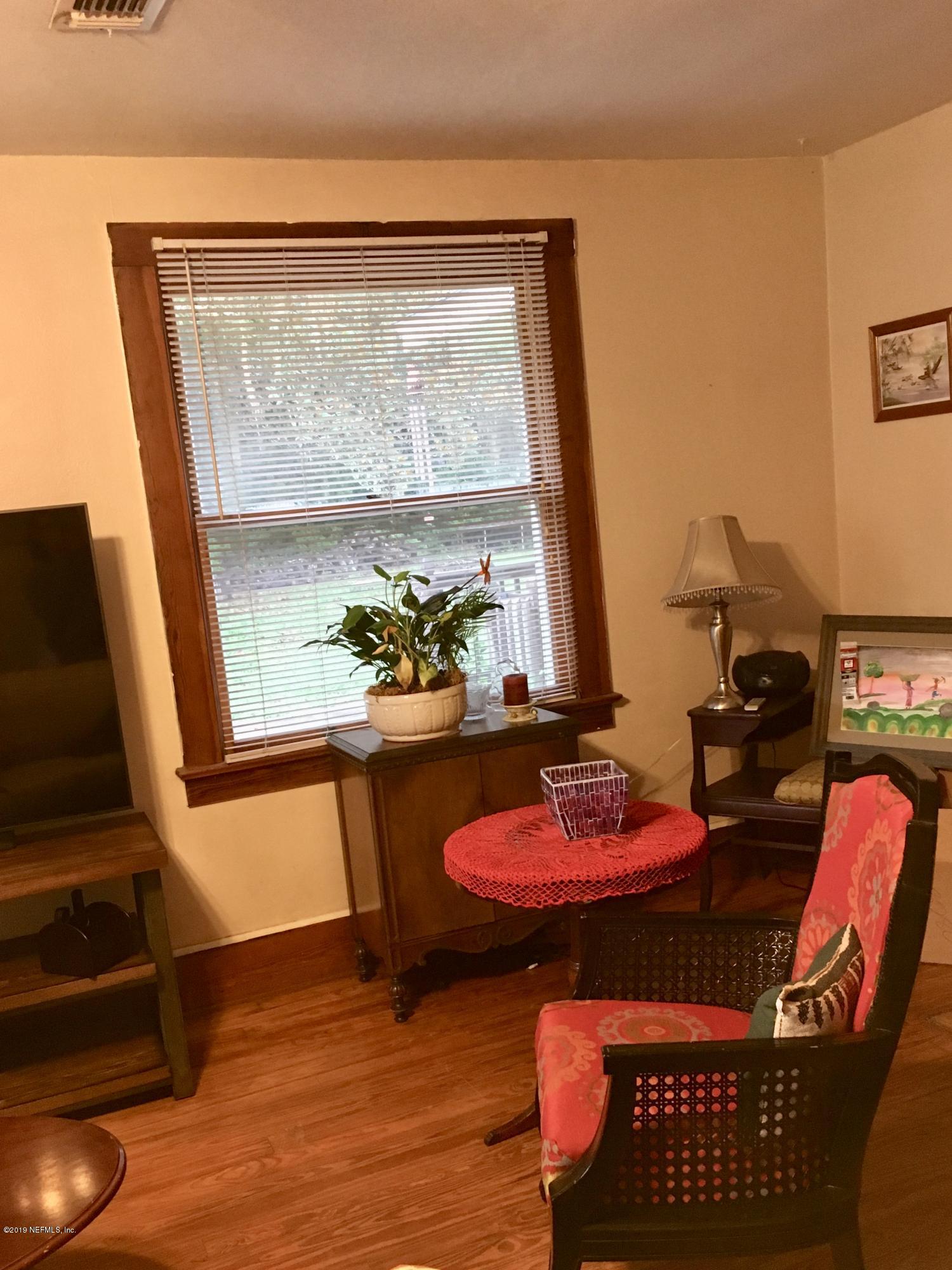 11628 Flynn Road Jacksonville, FL 32223 - Photo 3 of 5 a view of a room with furniture and a potted plant