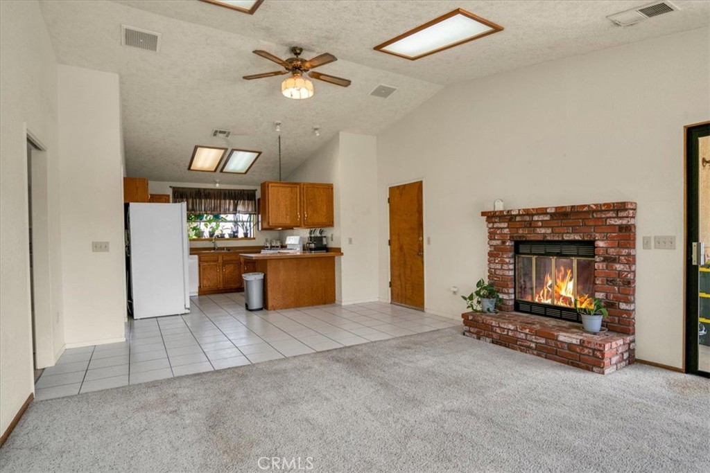72775 2 Mile Road Twentynine Palms, CA 92277 - Photo 11 of 55 a view of kitchen with furniture and a fireplace