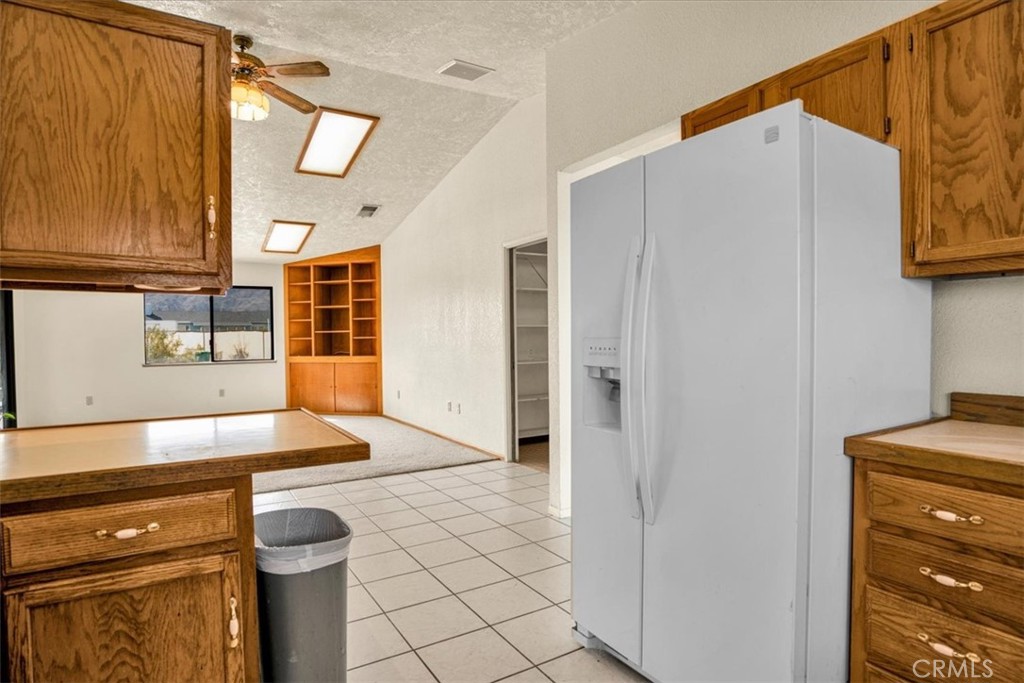 72775 2 Mile Road Twentynine Palms, CA 92277 - Photo 14 of 55 a kitchen with stainless steel appliances granite countertop a refrigerator and a stove
