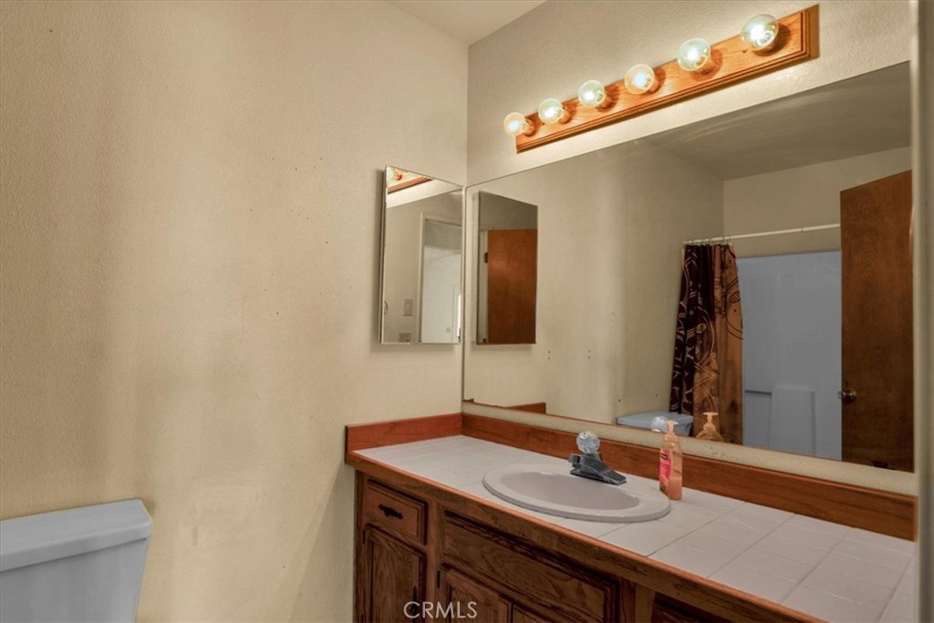 72775 2 Mile Road Twentynine Palms, CA 92277 - Photo 19 of 55 a bathroom with a sink and a mirror