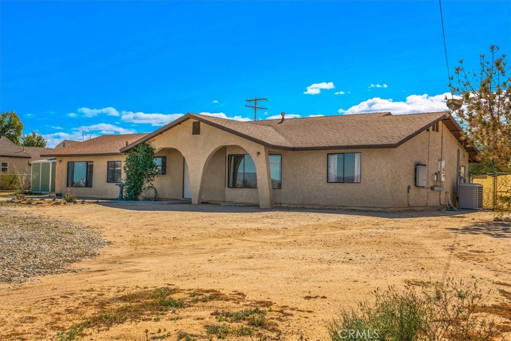 72775 2 Mile Road Twentynine Palms, CA 92277 - Photo 2 of 55 a house with yard in front of it