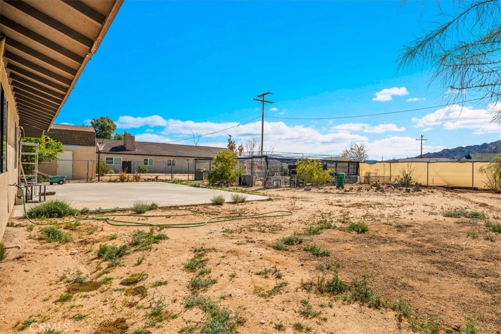 72775 2 Mile Road Twentynine Palms, CA 92277 - Photo 33 of 55 a view of a house with a yard