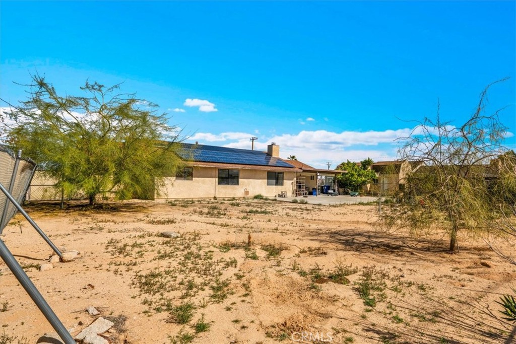 72775 2 Mile Road Twentynine Palms, CA 92277 - Photo 34 of 55 a view of a house with a yard