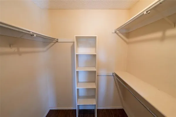 a view of an empty walk in closet