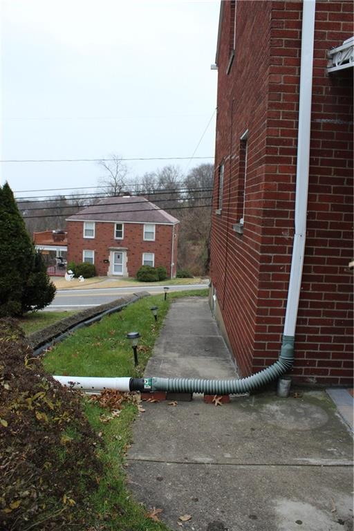 825 Geyer Road Pittsburgh, PA 15212 - Photo 20 of 20 a front view of a house with a garden and yard