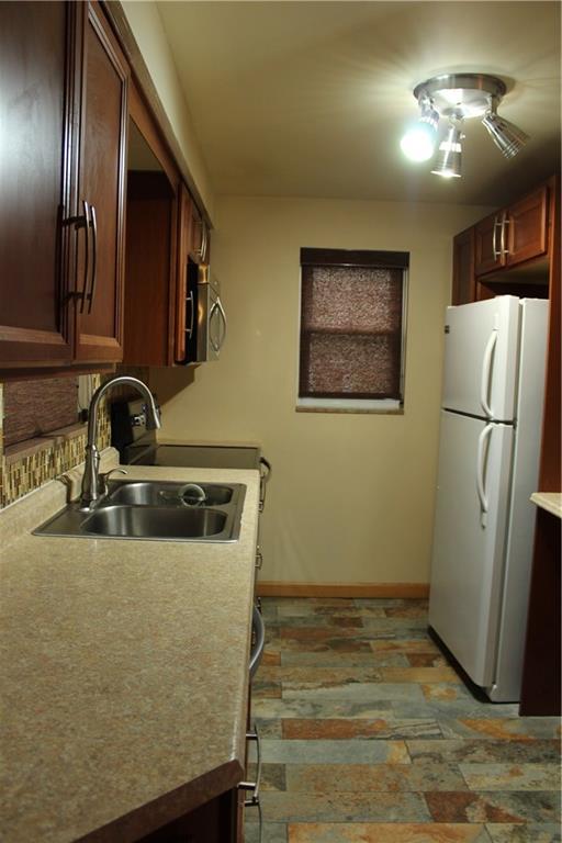 825 Geyer Road Pittsburgh, PA 15212 - Photo 5 of 20 a room with stainless steel appliances granite countertop a refrigerator and a sink
