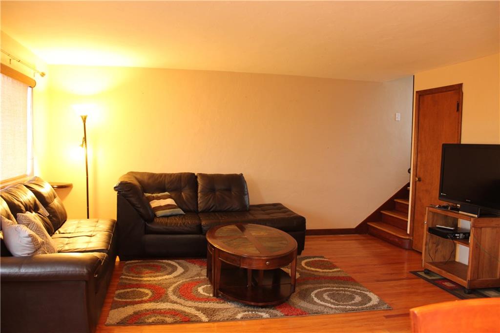 825 Geyer Road Pittsburgh, PA 15212 - Photo 6 of 20 a living room with furniture and a flat screen tv