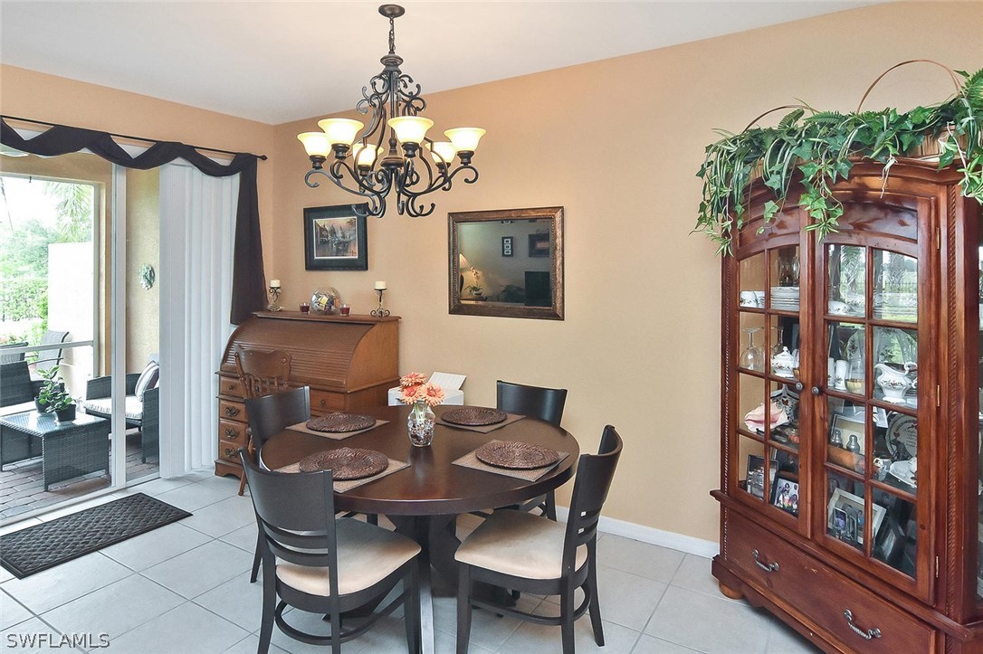 3840 Cherrybrook Loop Fort Myers, FL 33966 - Photo 11 of 32 a dining room with furniture and window