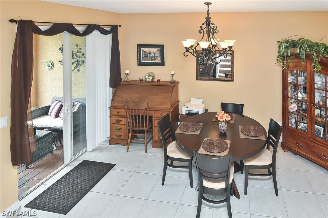 3840 Cherrybrook Loop Fort Myers, FL 33966 - Photo 12 of 32 a dining room with furniture and window