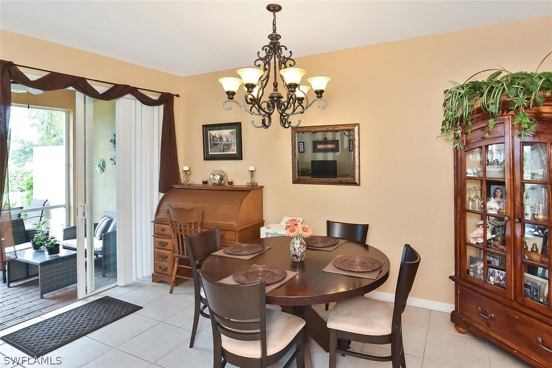 3840 Cherrybrook Loop Fort Myers, FL 33966 - Photo 13 of 32 a dining room with furniture and window