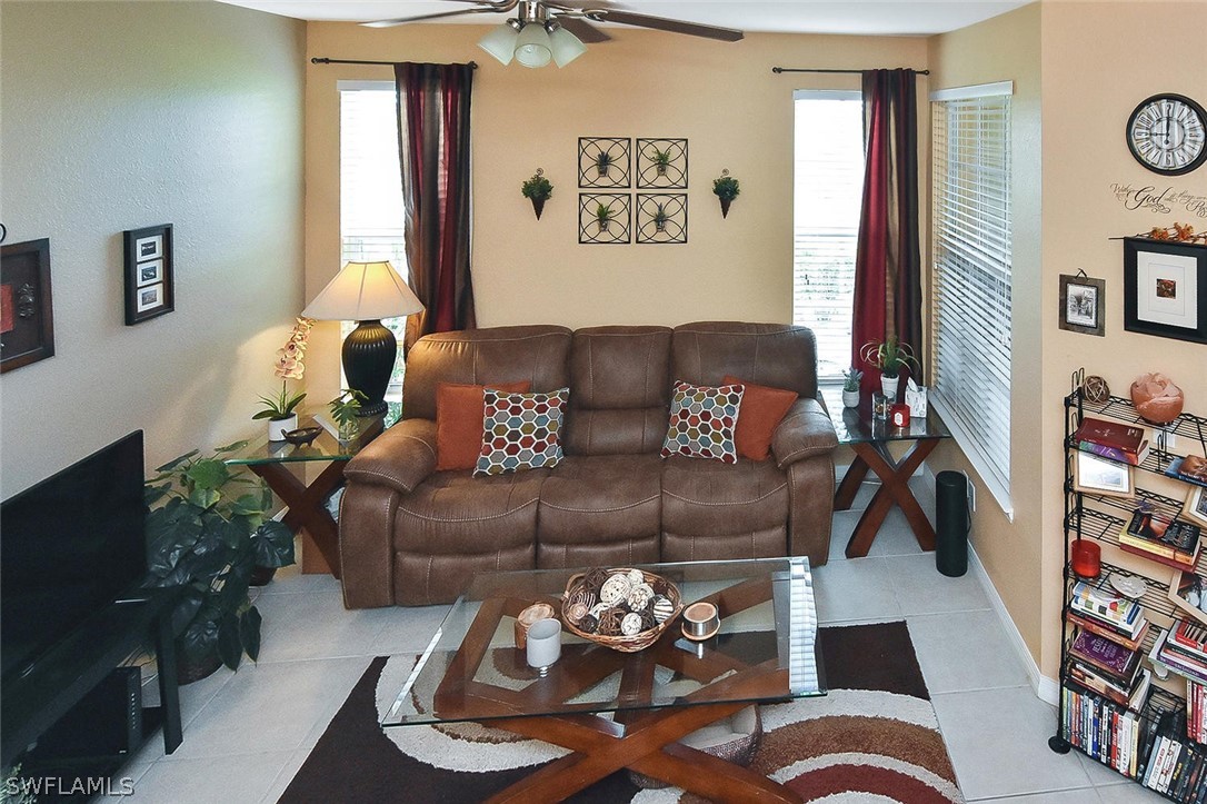 3840 Cherrybrook Loop Fort Myers, FL 33966 - Photo 16 of 32 a living room with furniture and a flat screen tv