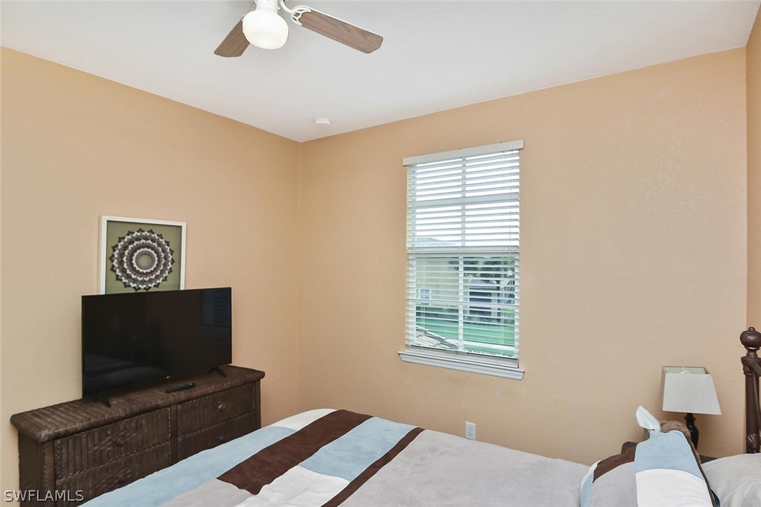 3840 Cherrybrook Loop Fort Myers, FL 33966 - Photo 24 of 32 a living room with furniture and a flat screen tv