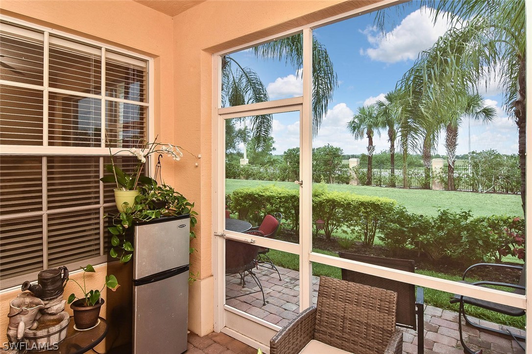 3840 Cherrybrook Loop Fort Myers, FL 33966 - Photo 26 of 32 a view of a balcony with lake view and a potted plant