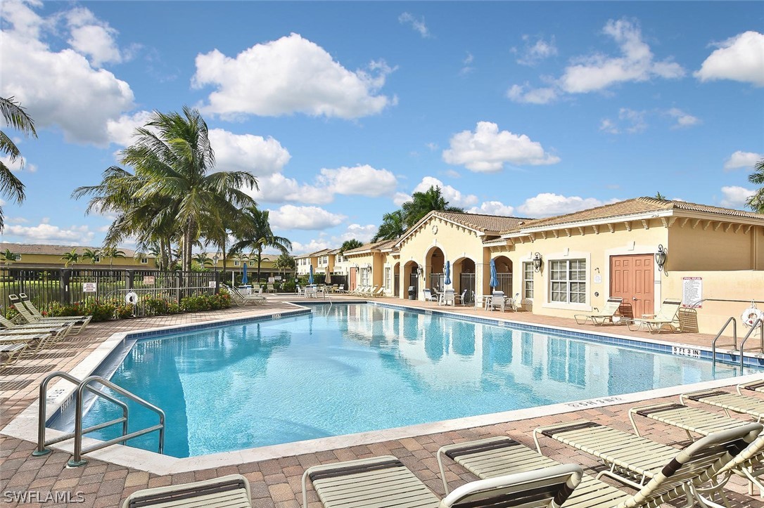 3840 Cherrybrook Loop Fort Myers, FL 33966 - Photo 32 of 32 a view of a swimming pool with a lounge chairs