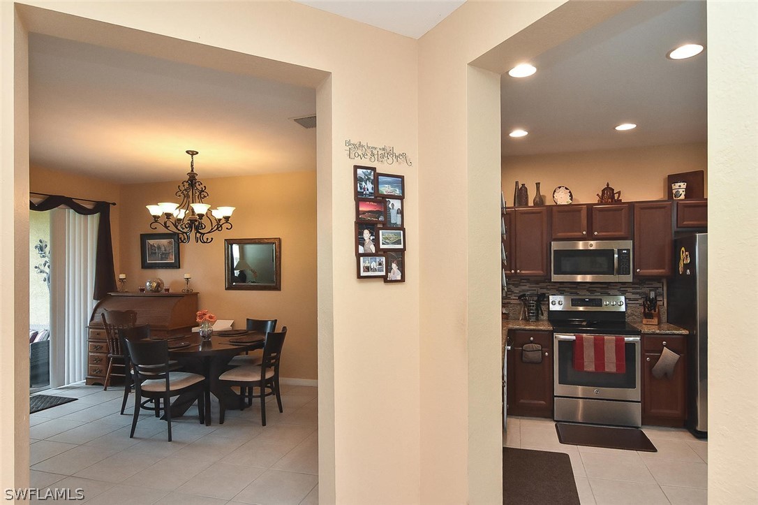 3840 Cherrybrook Loop Fort Myers, FL 33966 - Photo 6 of 32 a view of a dining room with furniture