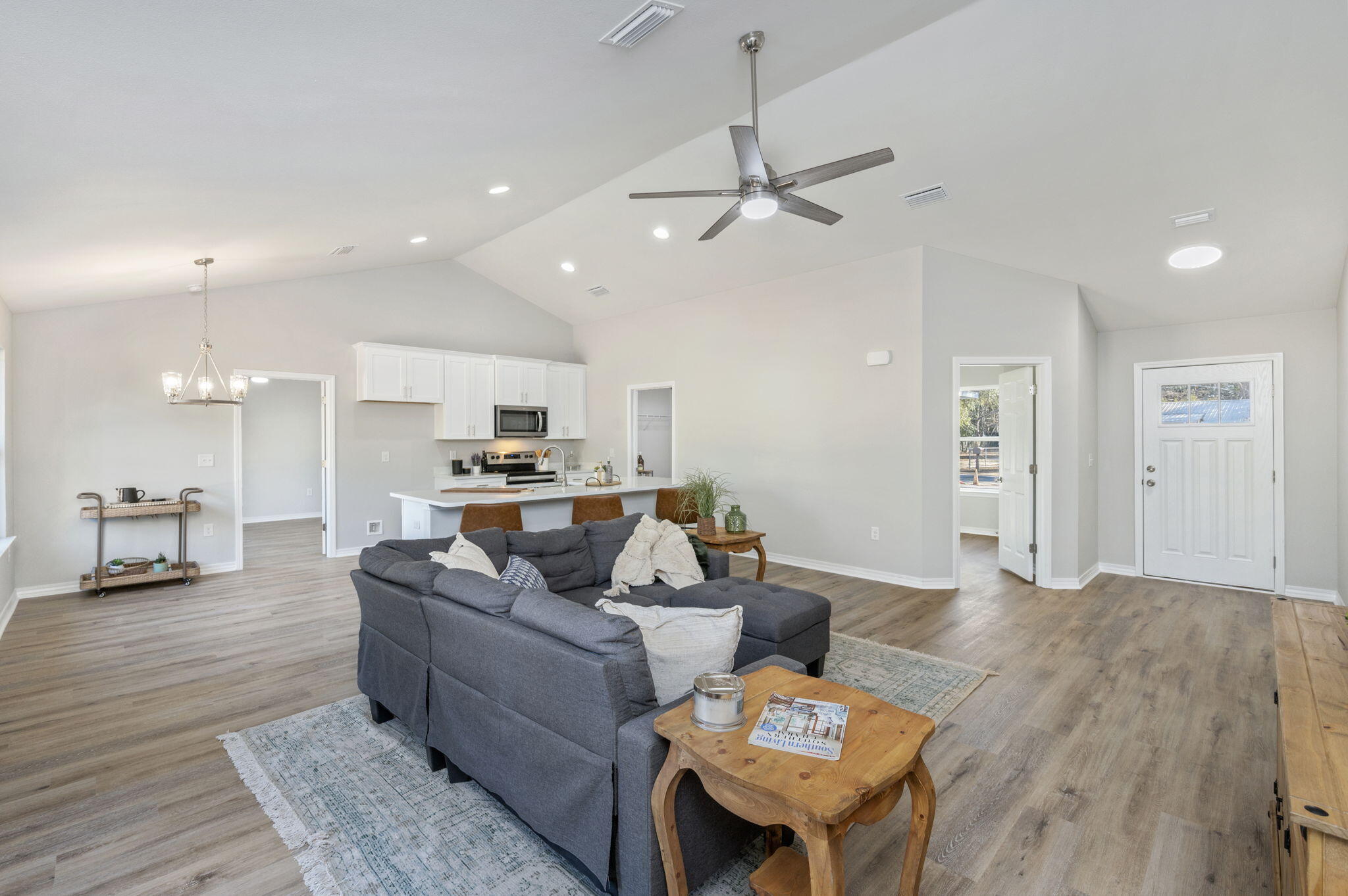 6200 Redeemer Way Crestview, FL 32539 - Photo 7 of 13 a living room with furniture and a wooden floor
