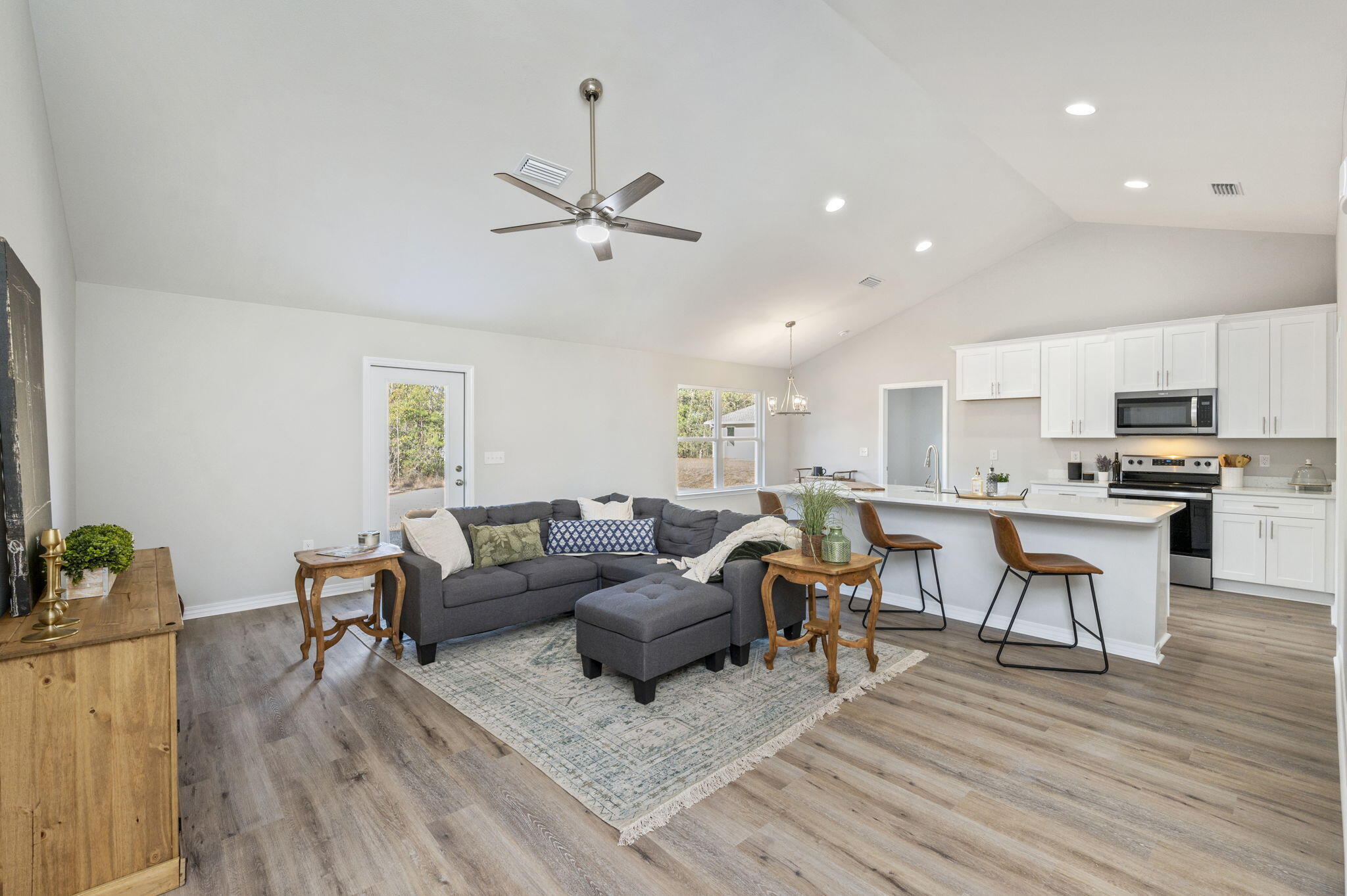 6200 Redeemer Way Crestview, FL 32539 - Photo 8 of 13 a living room with furniture and kitchen view