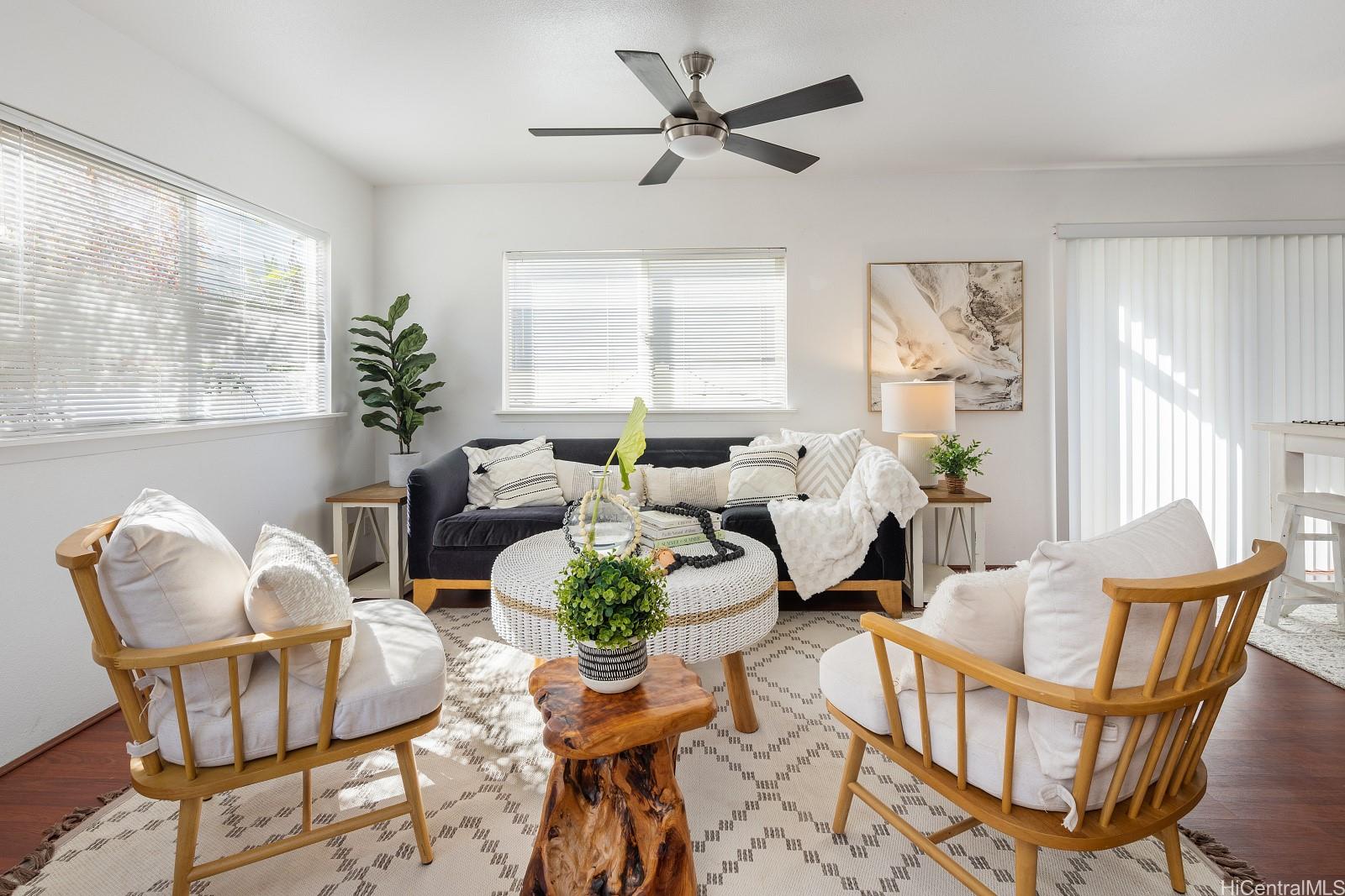 92-7049 Elele Street, Unit 22 Kapolei, HI 96707 - Photo 2 of 8 a living room with furniture and a window