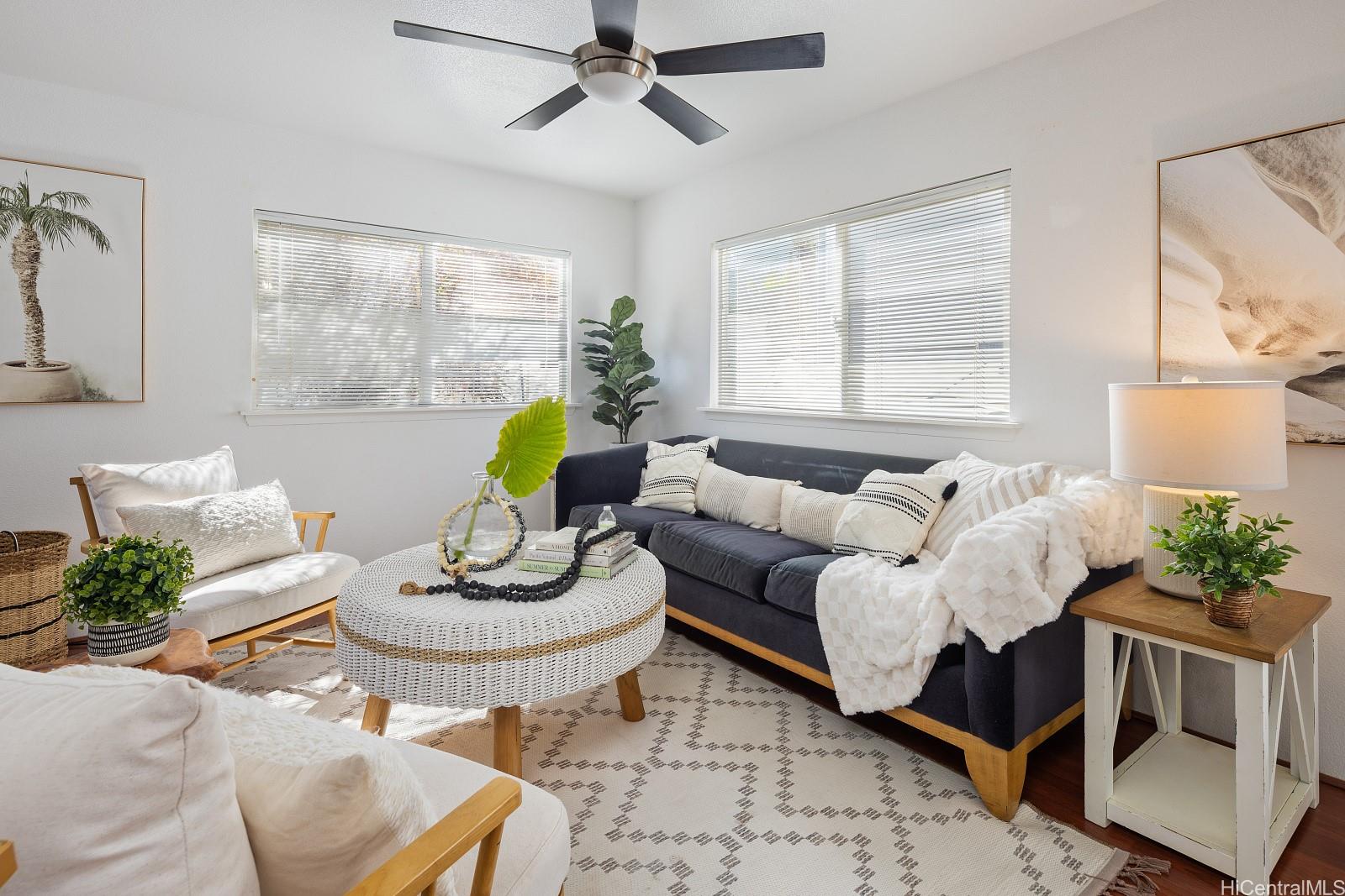 92-7049 Elele Street, Unit 22 Kapolei, HI 96707 - Photo 3 of 8 a living room with furniture and a potted plant