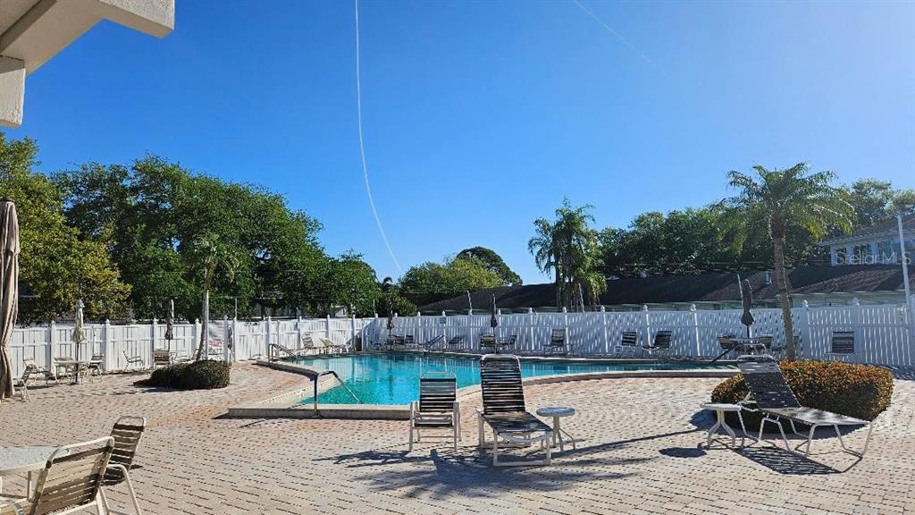 4600 98th Way North, Unit 210 St. Petersburg, FL 33708 - Photo 31 of 33 a view of a backyard with sitting area