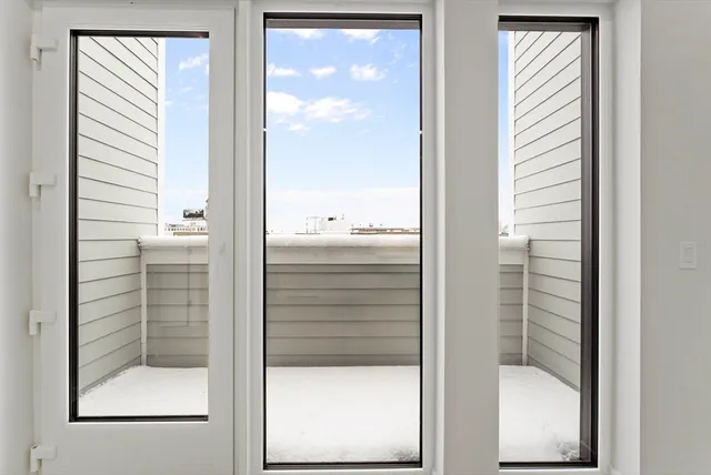 a bathroom with a glass shower door