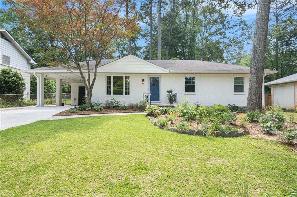 1353 Talcott Place Decatur, GA 30033 - Photo 1 of 1 a front view of a house with a yard