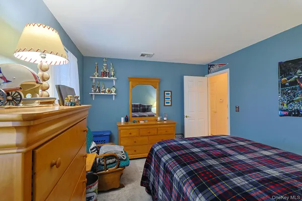 a bedroom with a bed and a table