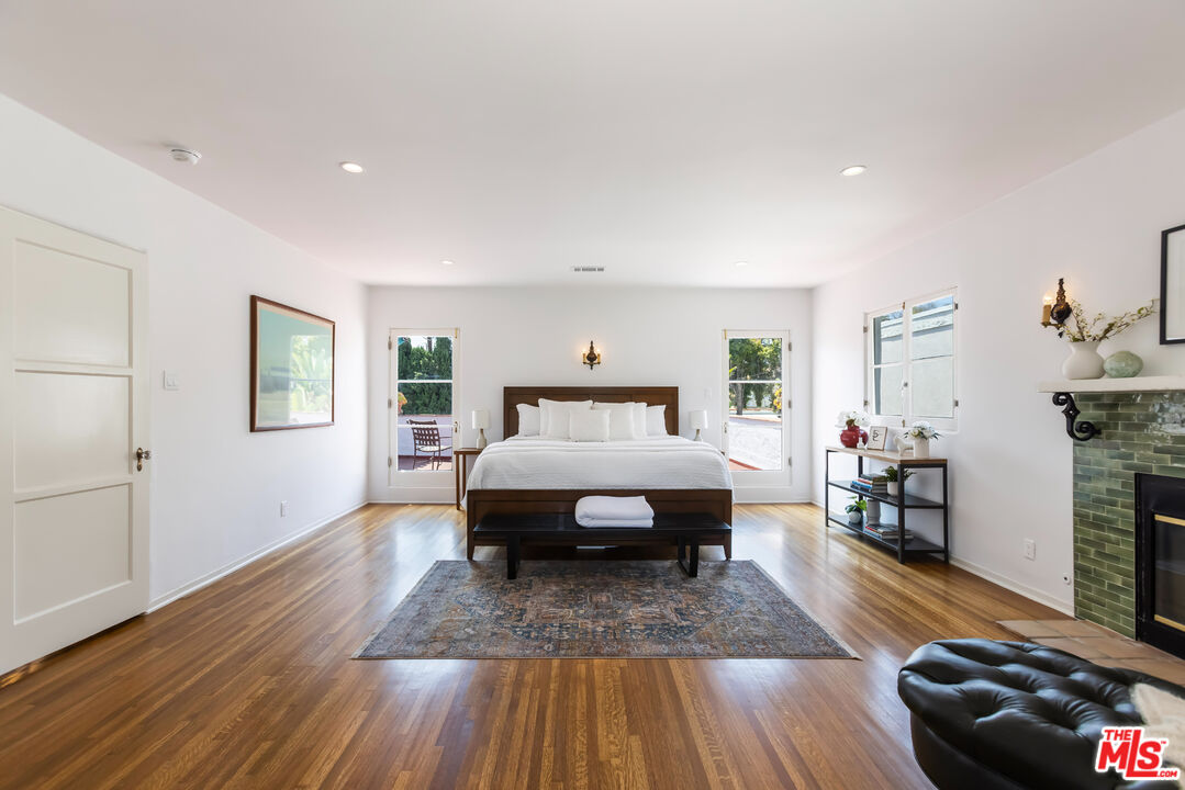 1743 Virginia Road Los Angeles, CA 90019 - Photo 38 of 75 a spacious bedroom with a bed and a wooden floor