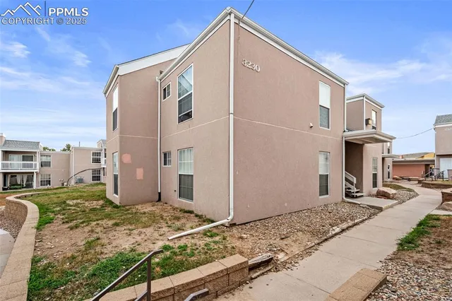 a front view of a house with trees