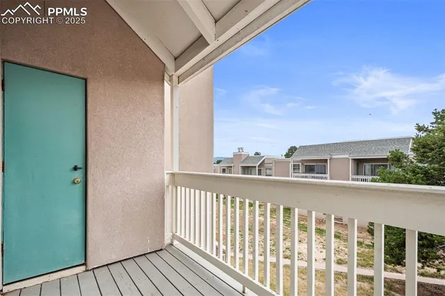 a view of a balcony with city view