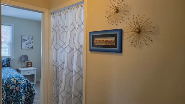 a wall with a wall paintings and a painting on the wall