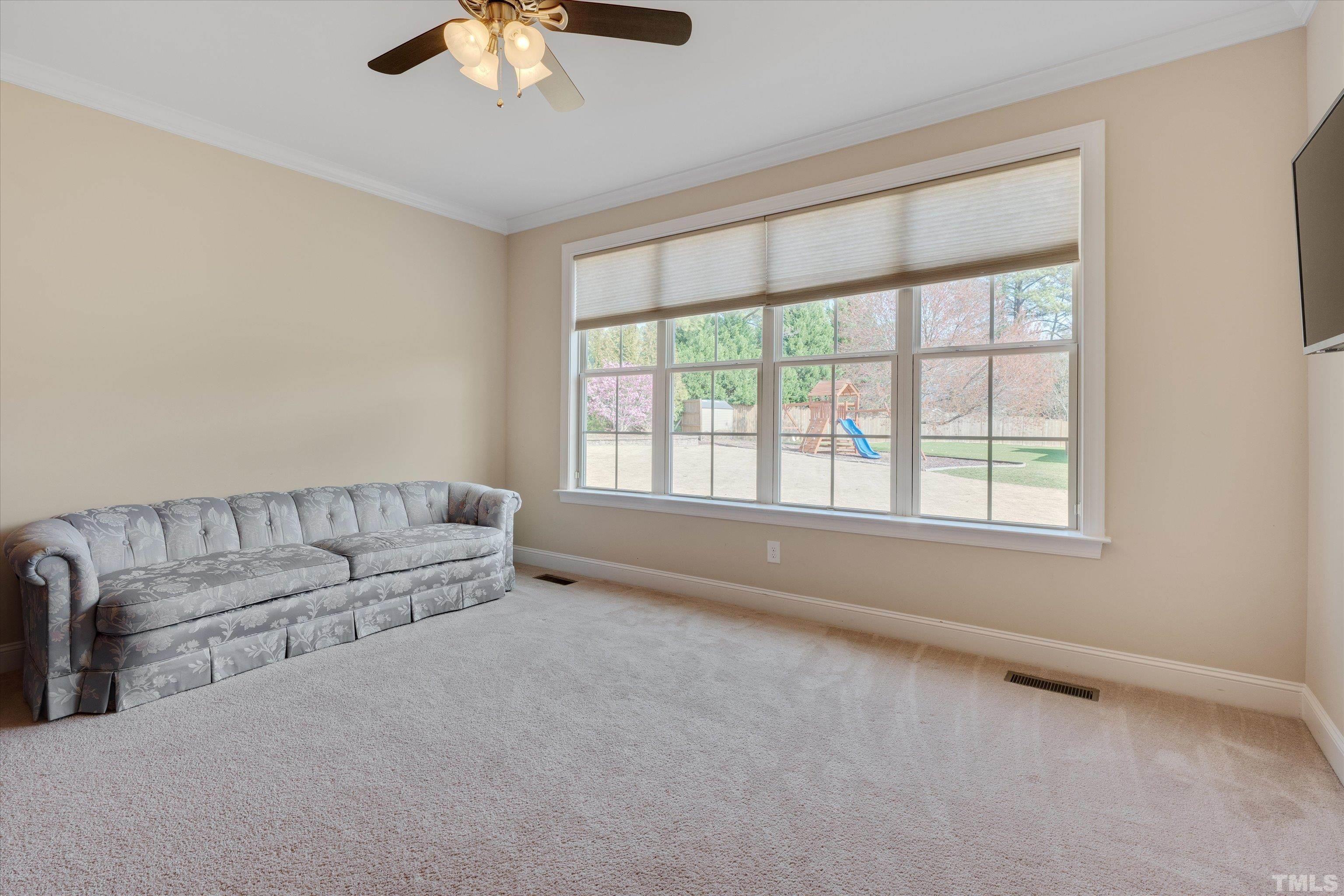 2704 Full Circle Raleigh, NC 27613 - Photo 13 of 32 a living room with furniture and a window