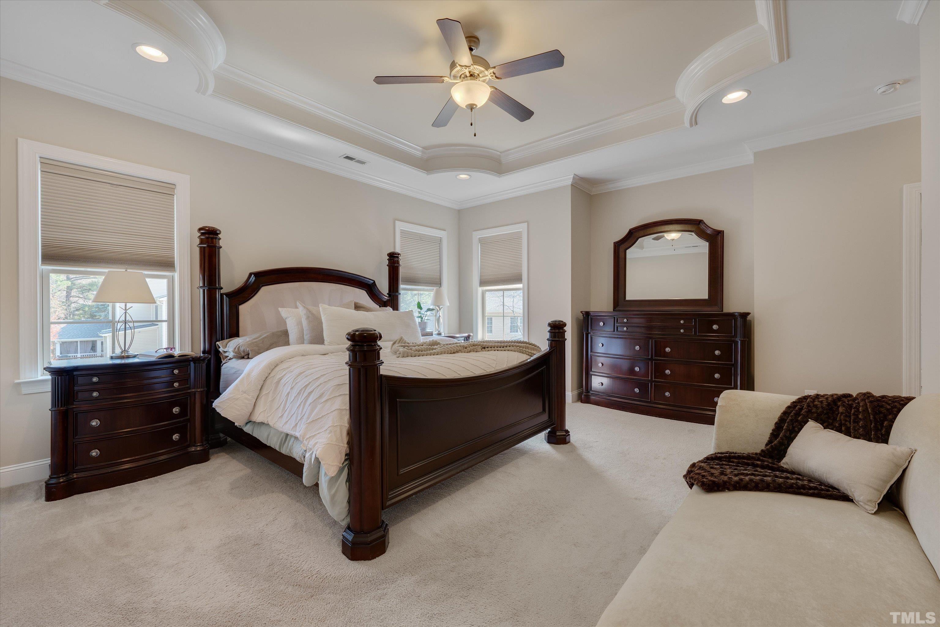 2704 Full Circle Raleigh, NC 27613 - Photo 19 of 32 a spacious bedroom with a bed and a dresser