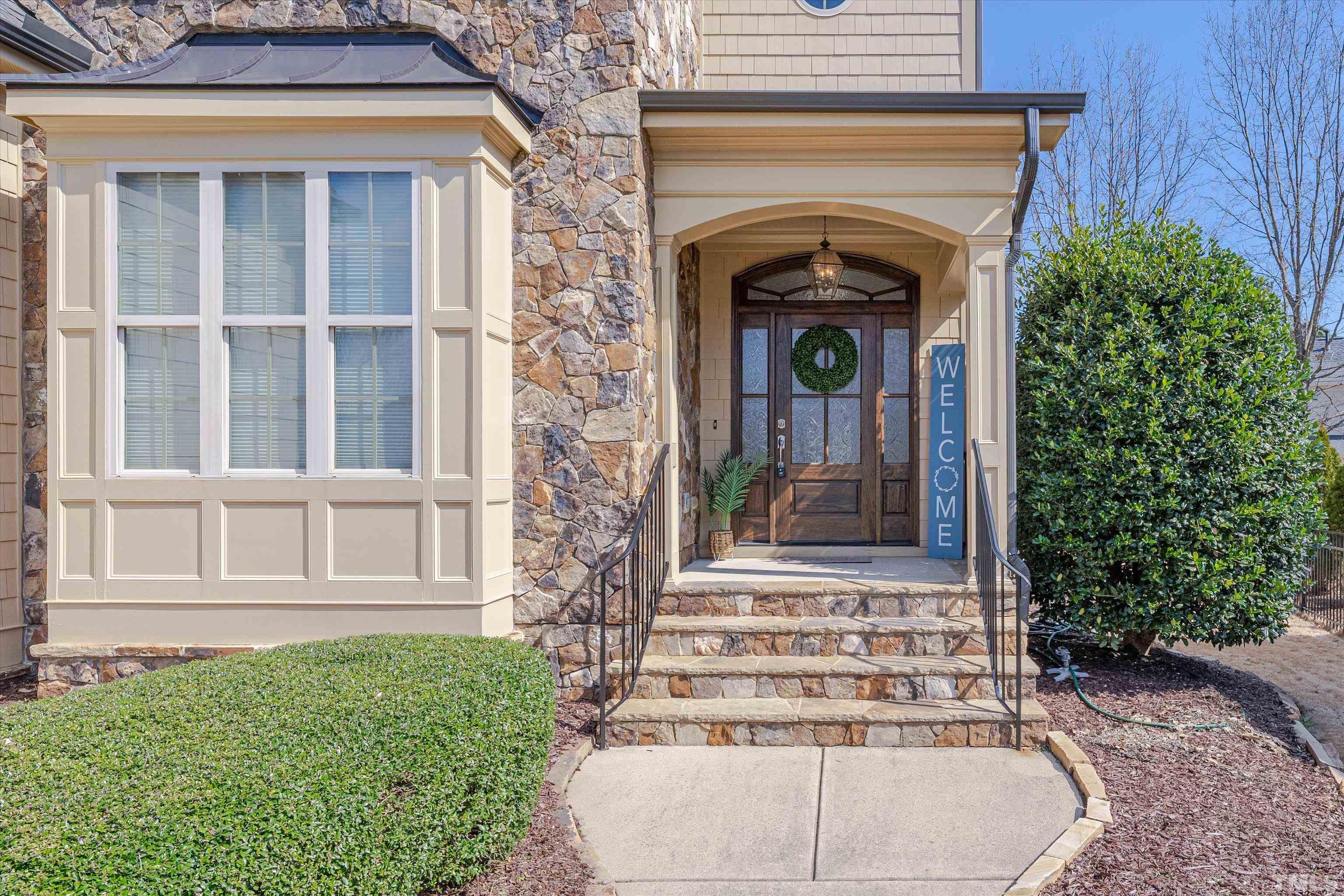 2704 Full Circle Raleigh, NC 27613 - Photo 2 of 32 a front view of a house with plants