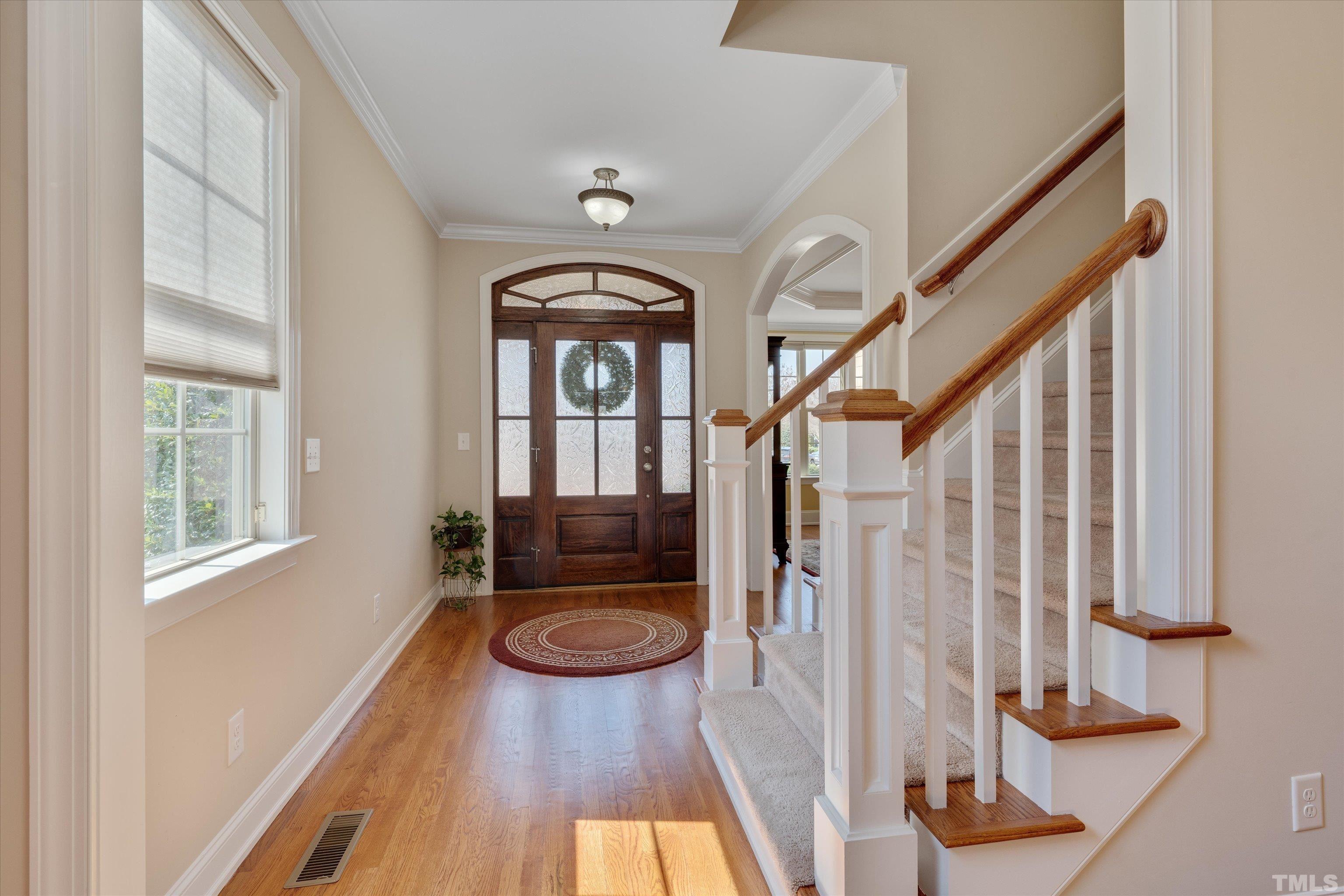 2704 Full Circle Raleigh, NC 27613 - Photo 3 of 32 a view of entryway with wooden floor and door