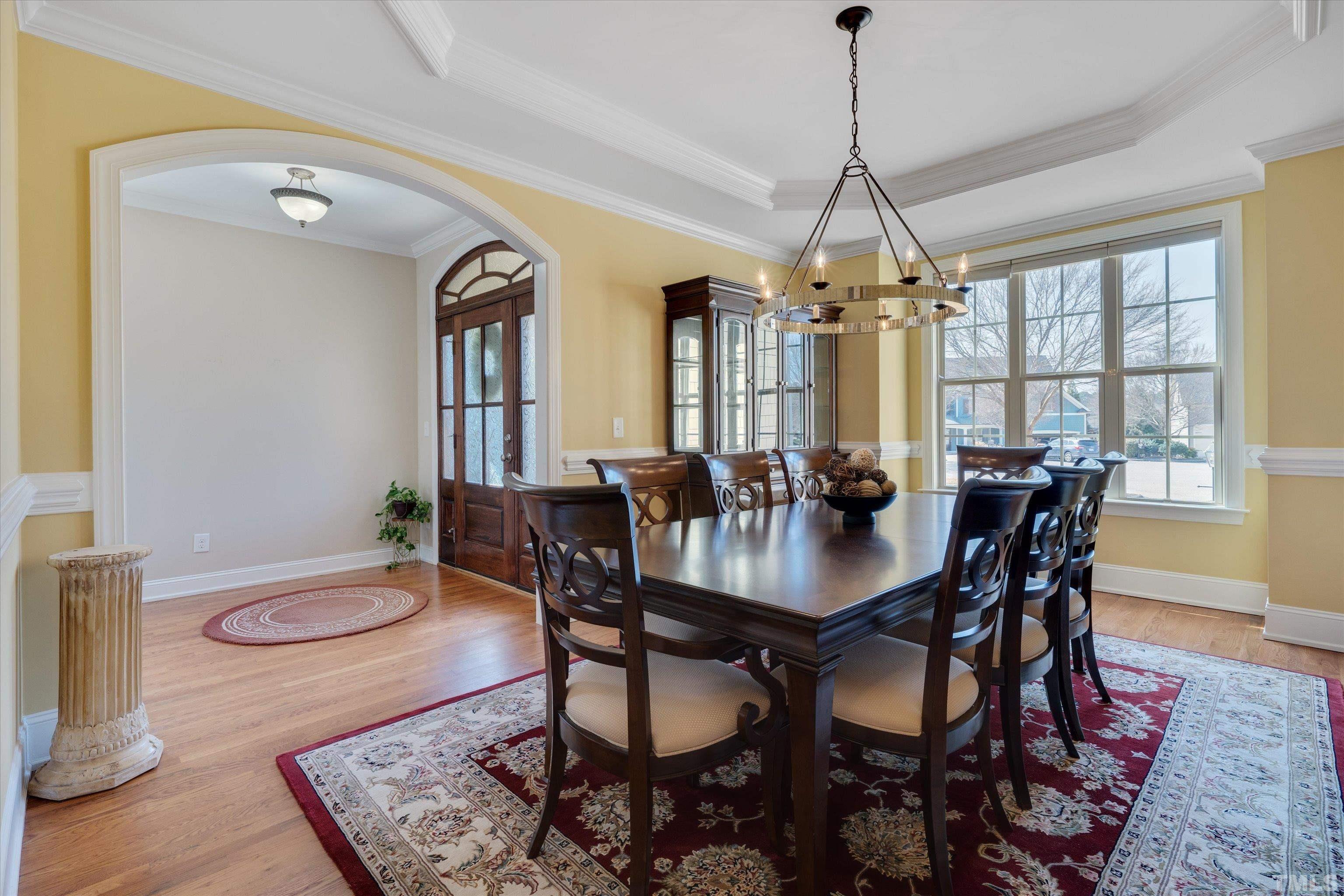 2704 Full Circle Raleigh, NC 27613 - Photo 4 of 32 a view of a a dining room with furniture window and wooden floor