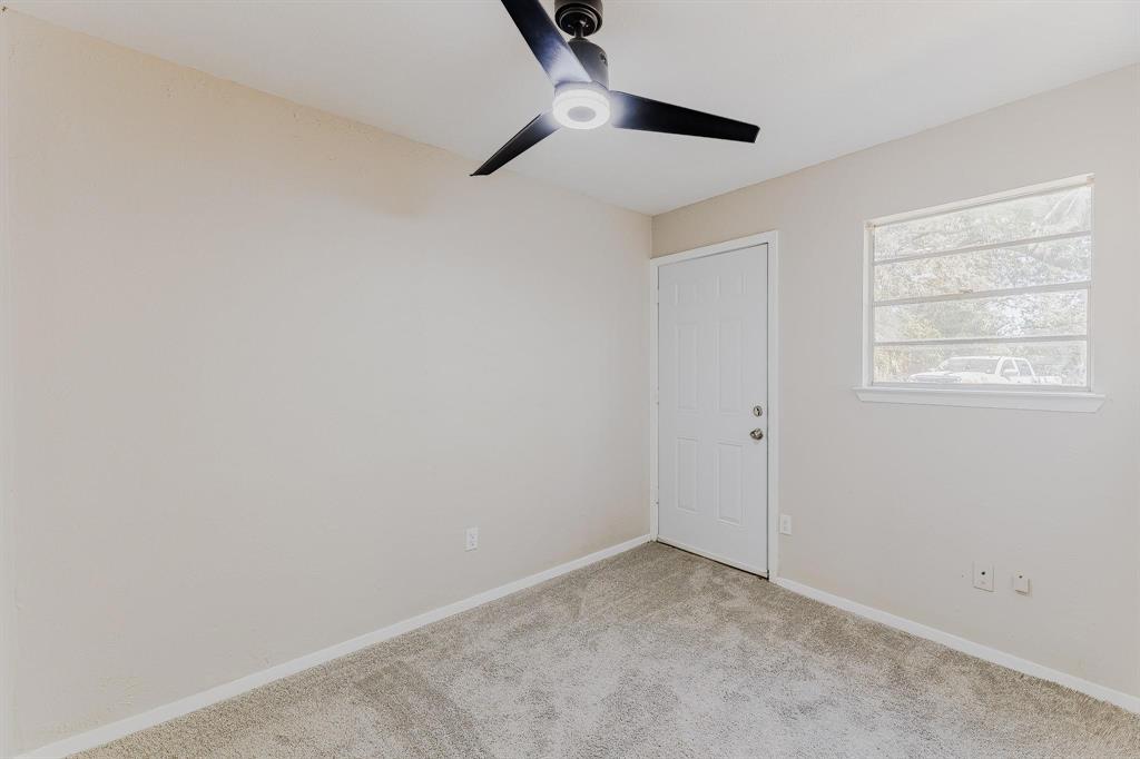 3305 Elm Grove Road Rowlett, TX 75098 - Photo 20 of 24 Carpeted spare room featuring baseboards and ceiling fan